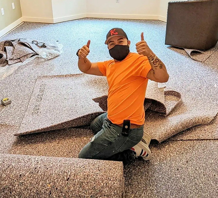 worker starting carpet installation nc